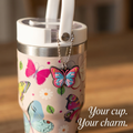 Butterfly charm clipped to a charm lid on a CrewCup